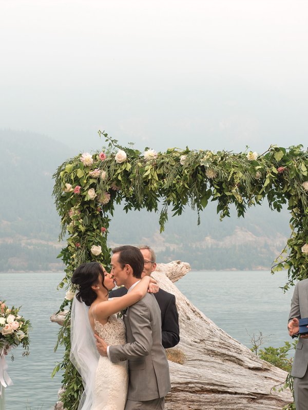 bride and groom first kiss